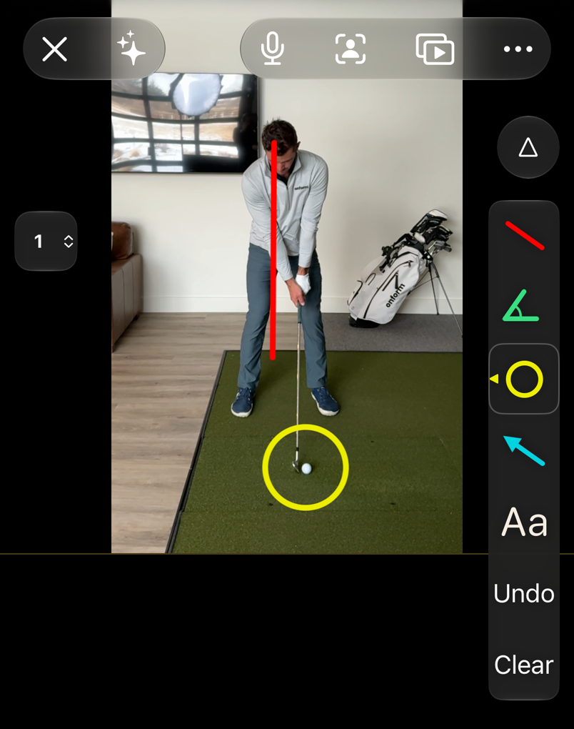 The drawing toolbar open beside a paused golf swing, with the line, angle, circle, arrow and text tools, Undo and Clear, and a red line and a yellow circle drawn on the video.