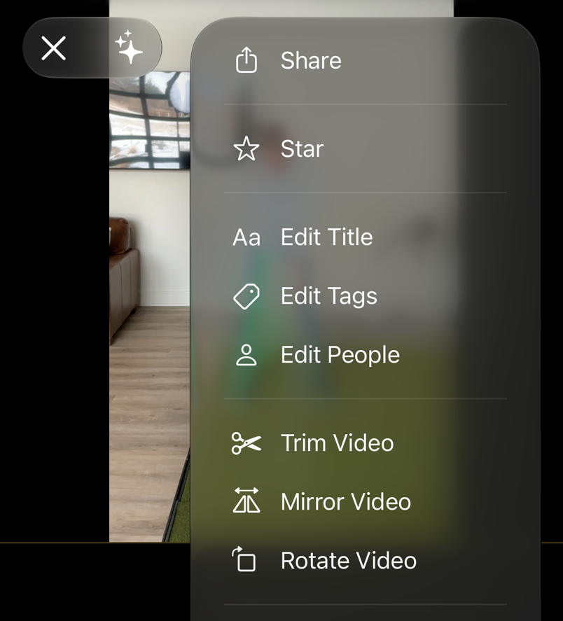 A video's more-options menu on iPhone listing Share, Star, Edit Title, Edit Tags, Edit People, Trim Video, Mirror Video and Rotate Video.